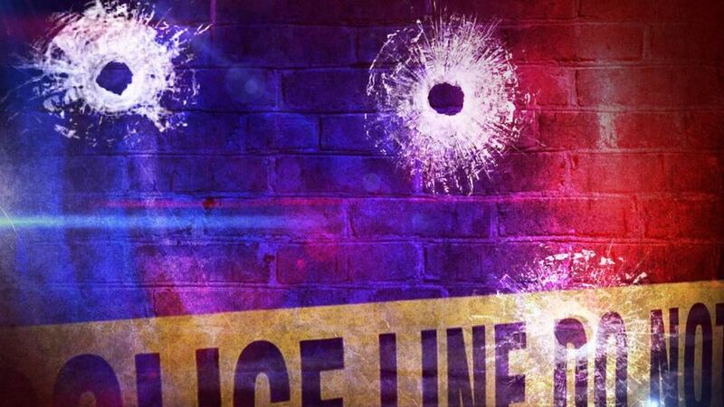 FILE - Crime scene with bullet holes