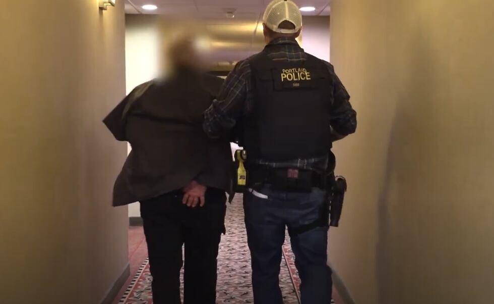 A person is arrested during part of a Portland sex trafficking bust by law enforcement.
