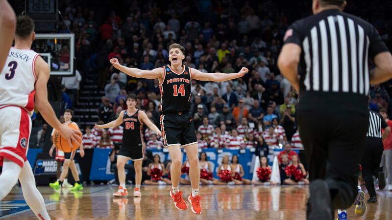 Princeton guard Matt Allocco (14) celebrates following the team's victory over Arizona in a...