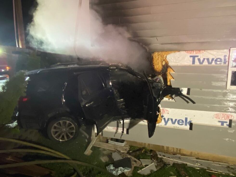 Car smashes into Vancouver house, both catch fire