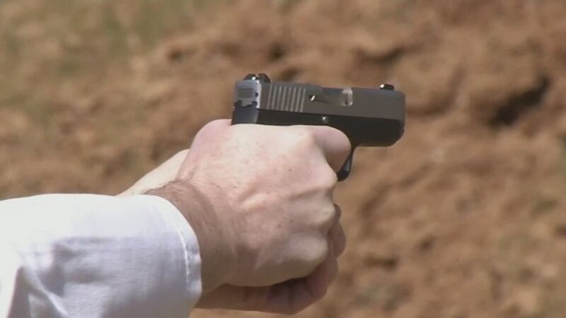 Man points gun.