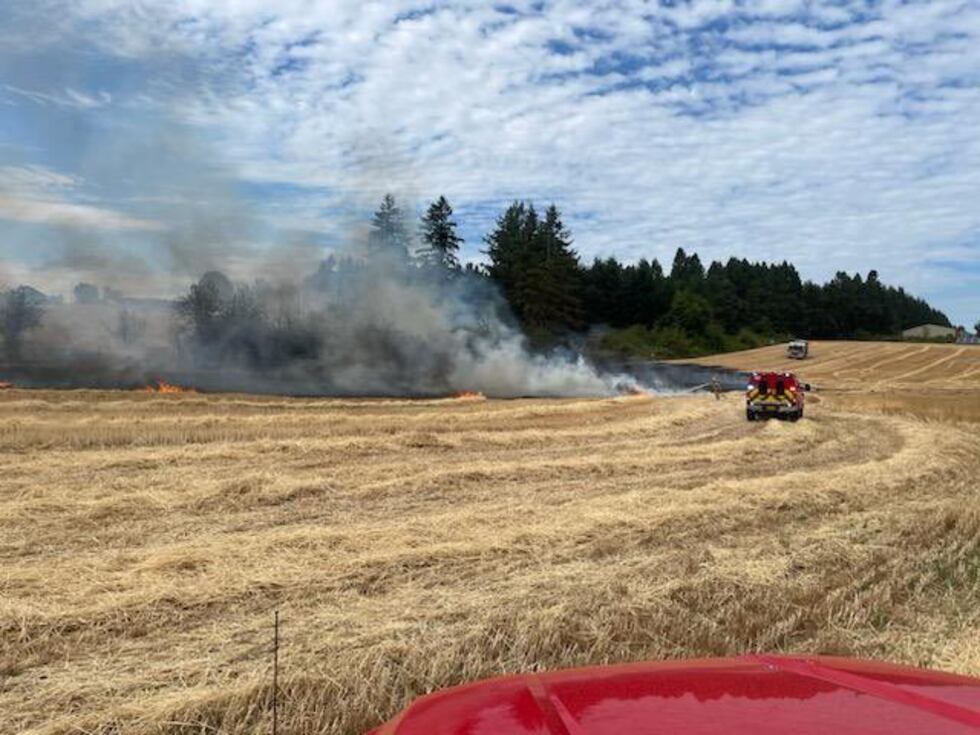 2-alarm fire in wheat field threatens house, horses in Clackamas County