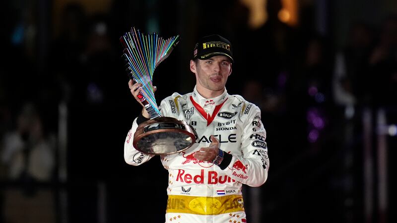 Red Bull driver Max Verstappen, of the Netherlands, holds a trophy after winning the Formula...