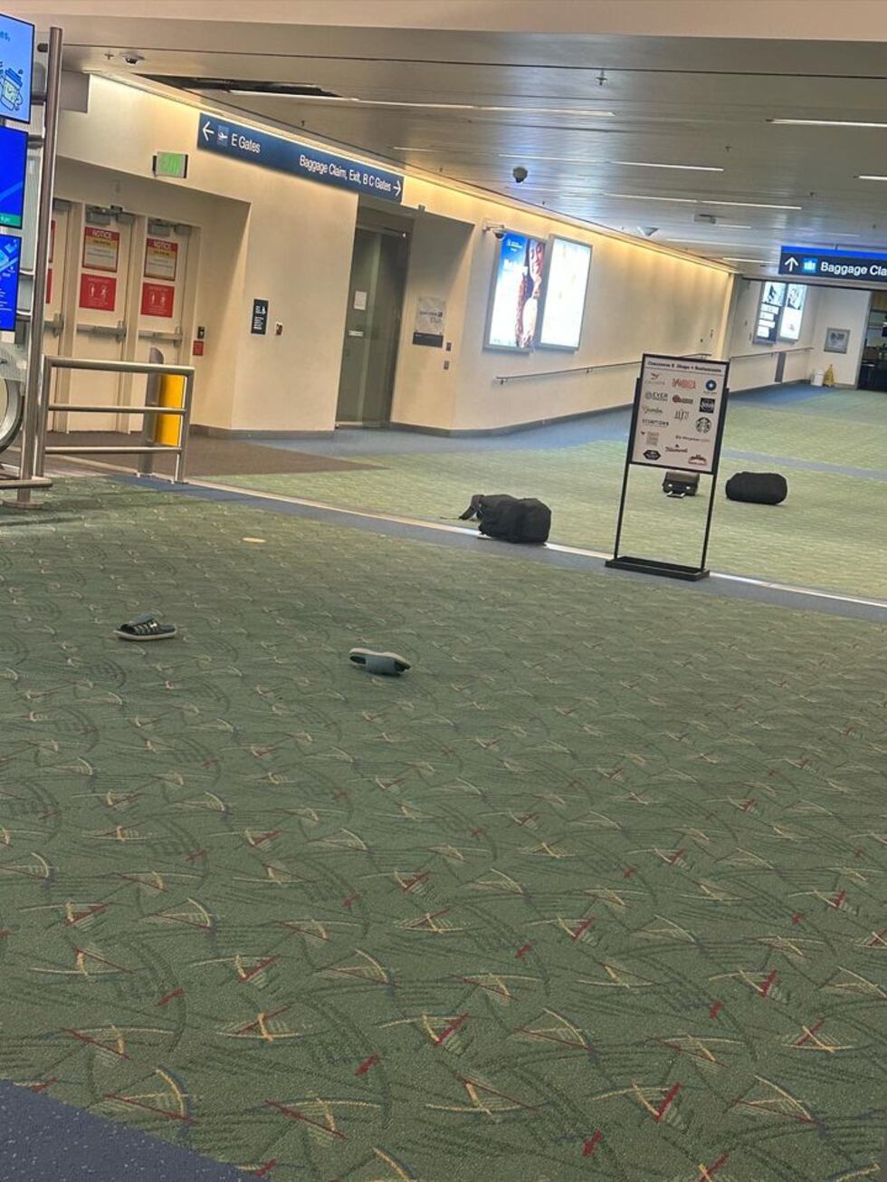 People dropped their luggage and even their shoes before running for cover when shots were...