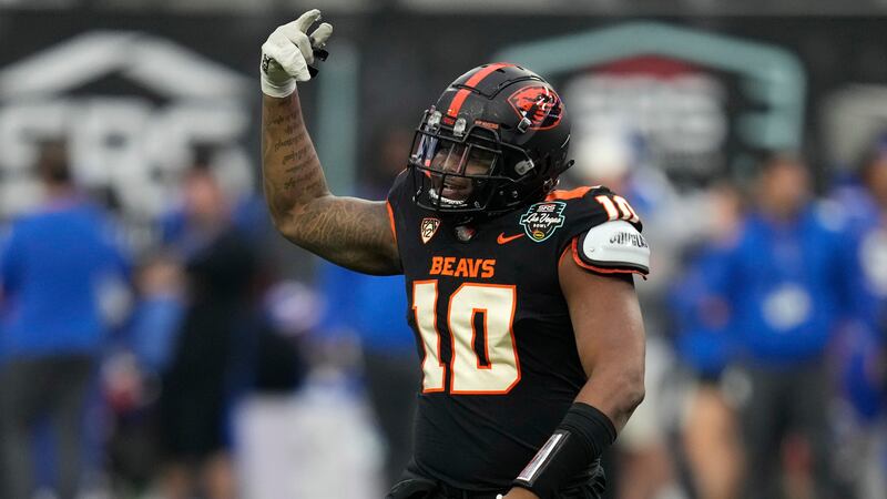 Oregon State linebacker Andrew Chatfield Jr. celebrates after making a sack against Florida...