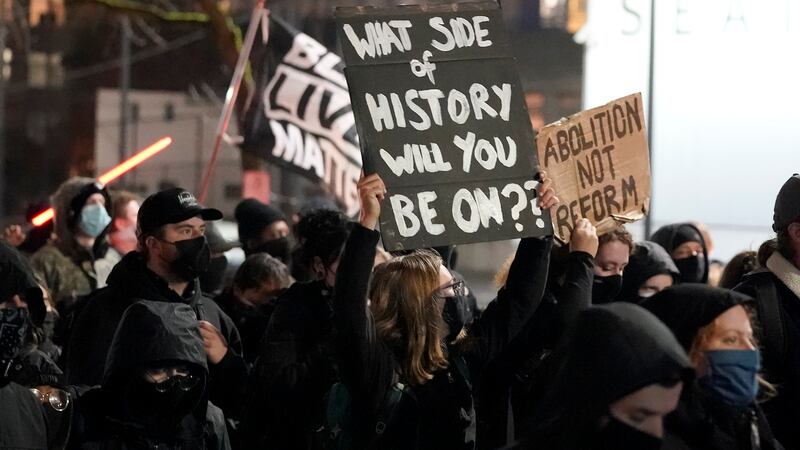 FILE - People march on the night of the election in Seattle, Tuesday, Nov. 3, 2020.