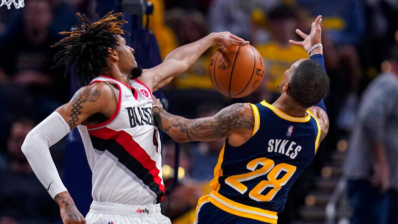 Portland Trail Blazers forward Greg Brown III (4) blocks the shot of Indiana Pacers guard...