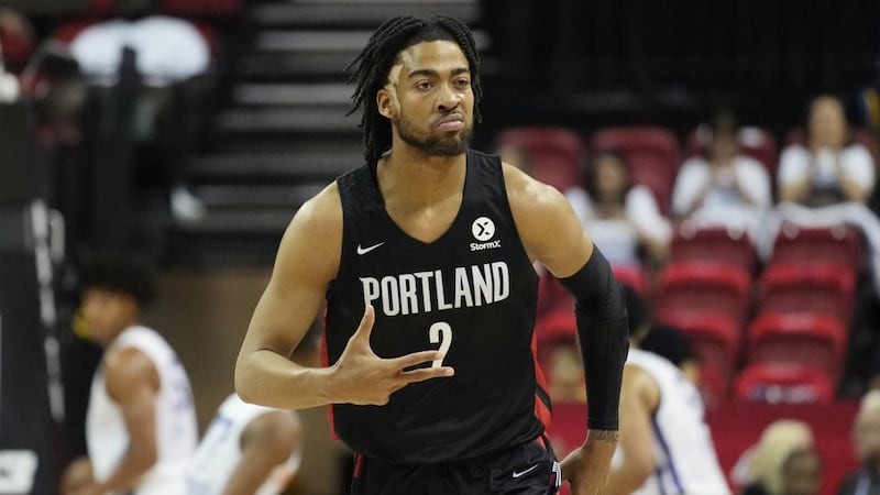 Portland Trail Blazers' Trendon Watford celebrates after making a 3-point shot against the New...