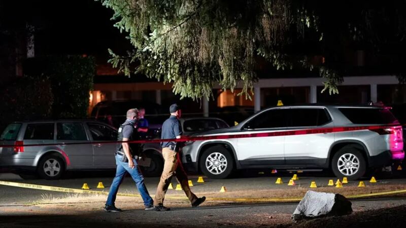 Police walk at the site of a police shooting on Sept. 3, 2020, in Lacey, Washington, where...
