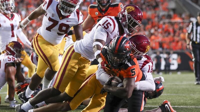 Oregon State running back Deshaun Fenwick scores a touchdown as Southern California linebacker...