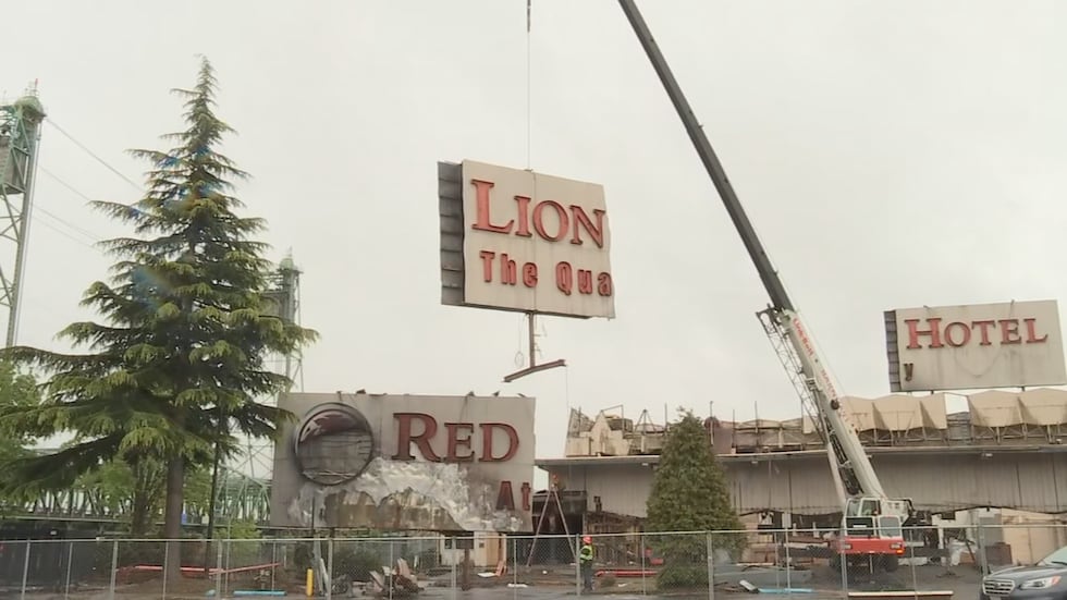 Crews removed the Red Lion Hotel sign Thursday, May 5.