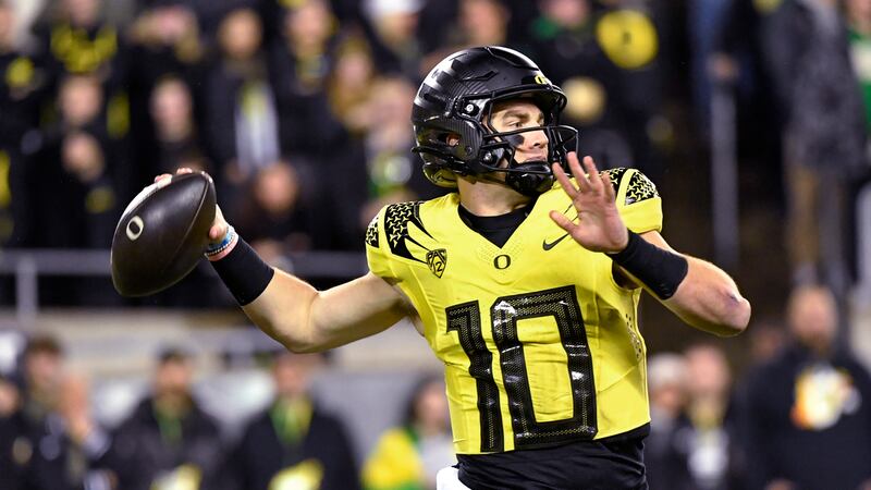 Oregon quarterback Bo Nix throws a pass against Southern California during the first half of...