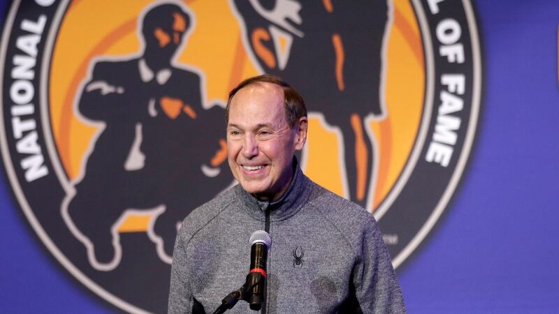 Former Purdue basketball player Terry Dischinger speaks during a news conference for...