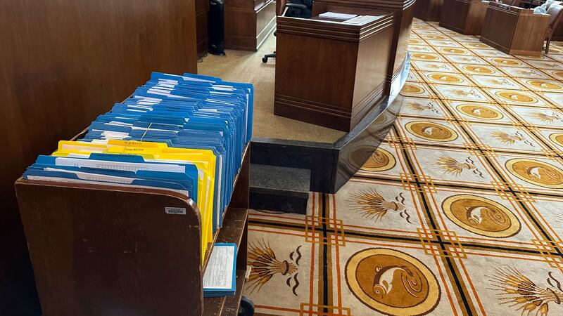 Hundreds of bills awaiting action in the Oregon Senate are held in a battered bookshelf on the...